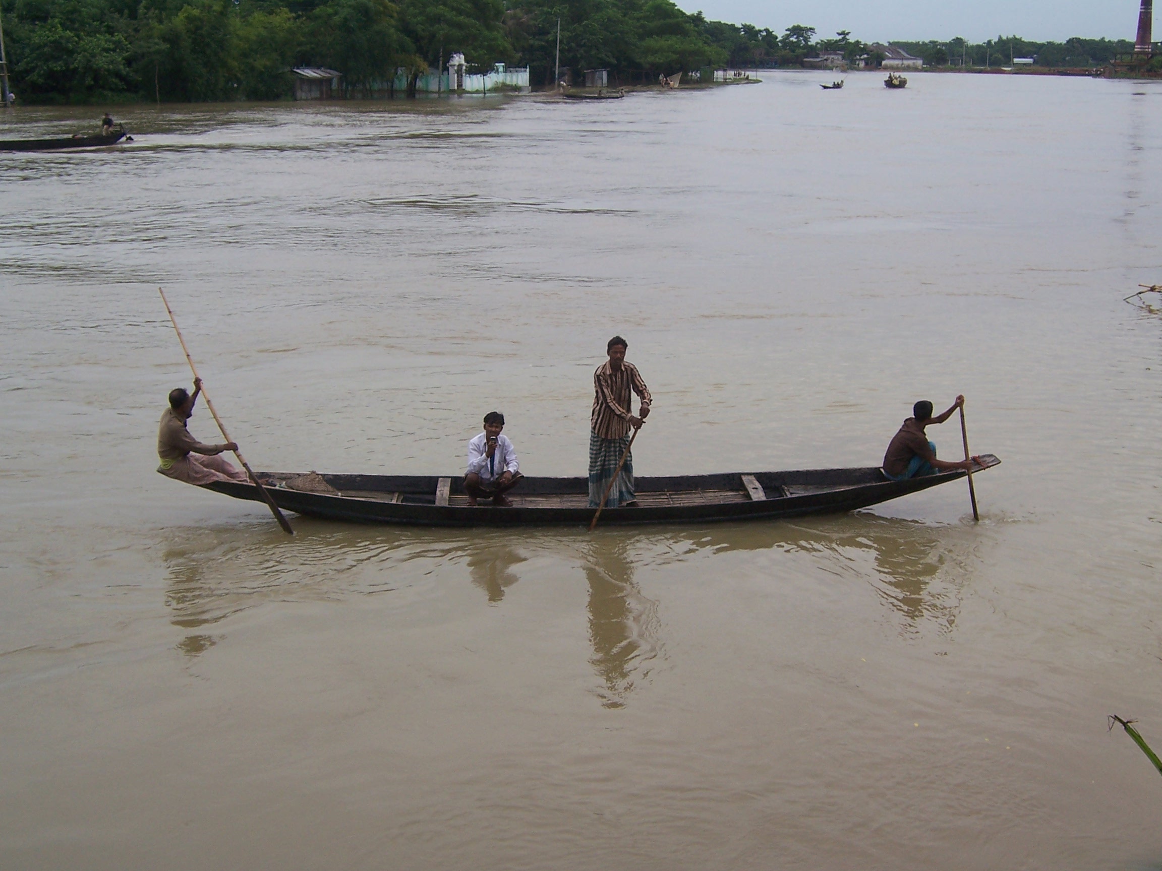 A man in a small river boat
