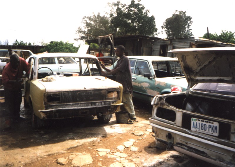 Two men repairing a truck