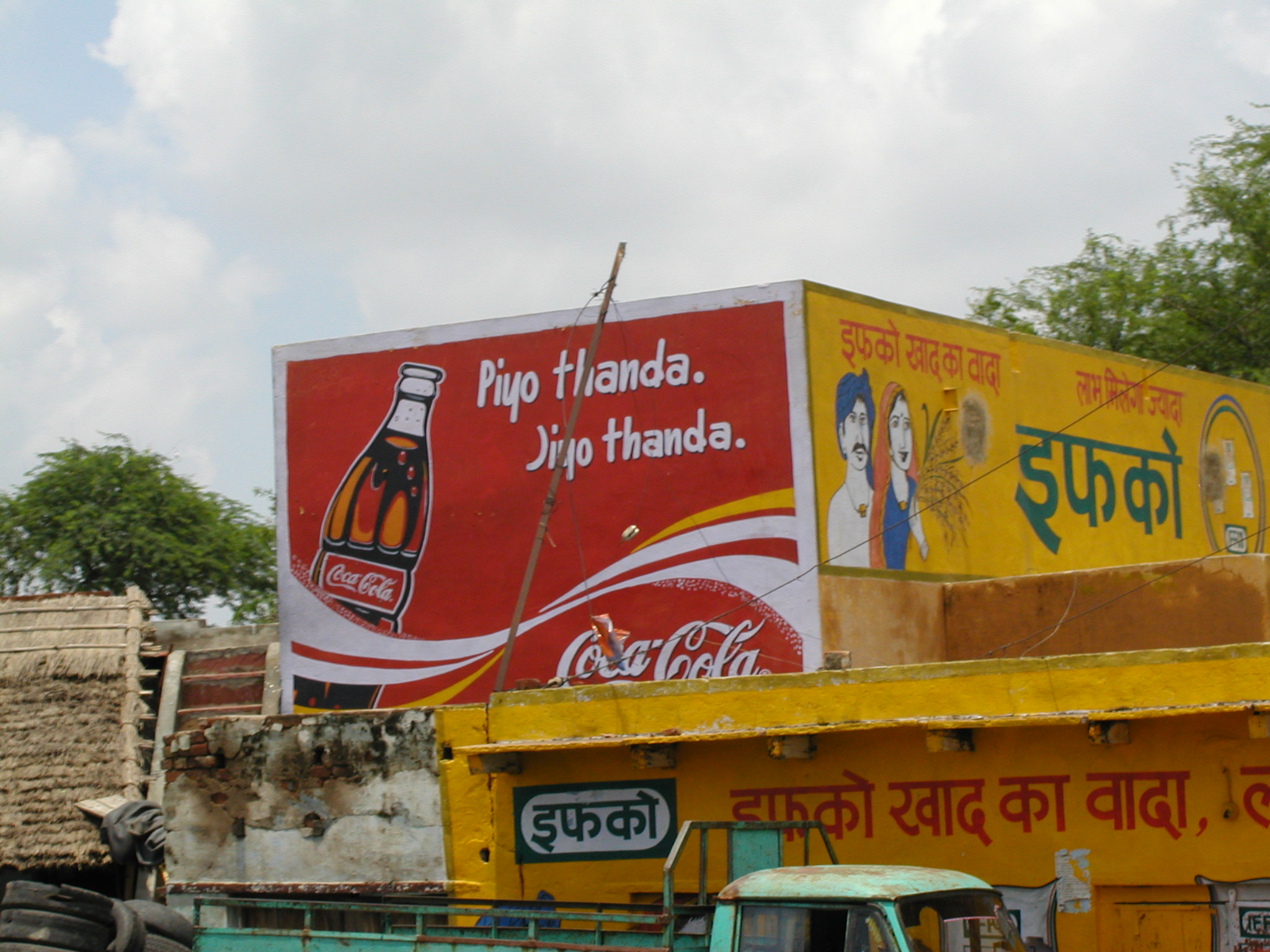 A billboard with a coke advertisement 