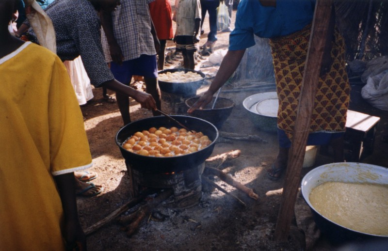 People cooking along the road 