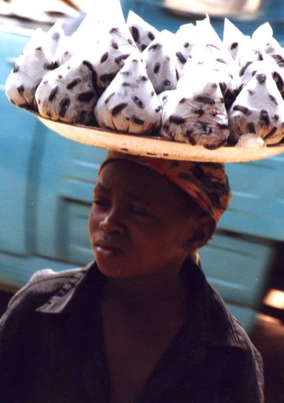 A girl carrying goods on her head