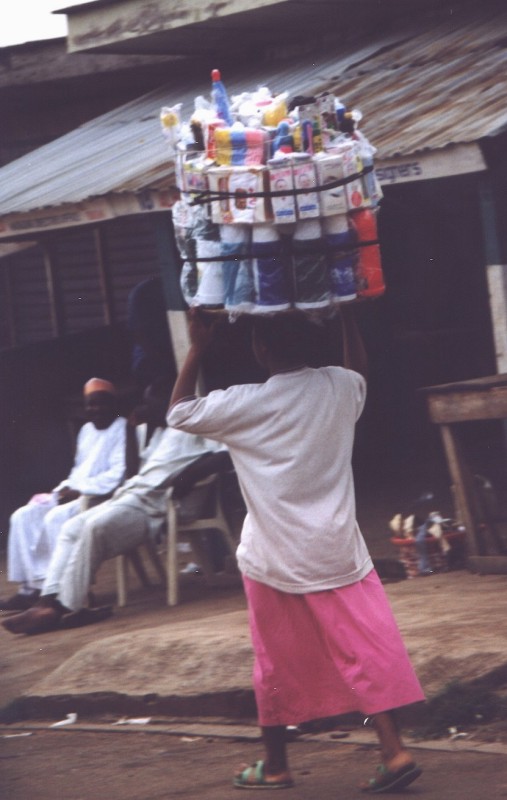 A woman carrying goods on her head