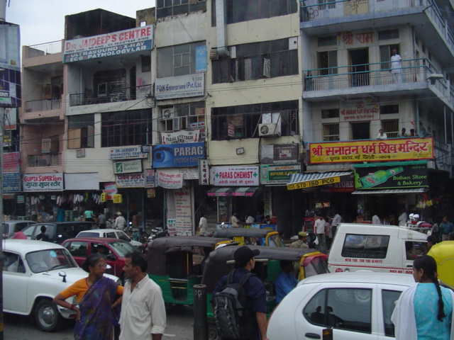 Buildings for shops and livings spaces covered in advertisements  