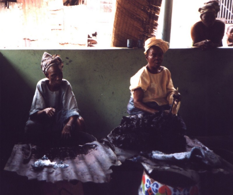 Women dyeing cloth with indigo