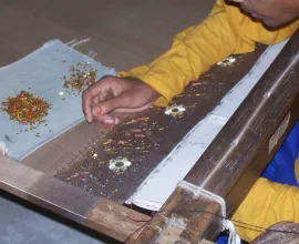 A silk product being made by hand.