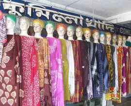 Mannequins display women's fashion in a clothing shop.