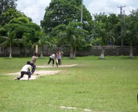 Some men play cricket in Bangladesh.