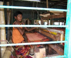 A child working in a silk factory.