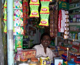 A convenience shop sells candy, gum, cigarettes, and other items.