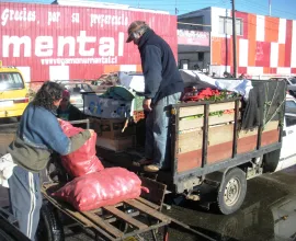 Unloading produce at a central market in Concepción.