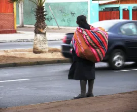 An Aymara woman with a traditional Andean blanket in Arica.