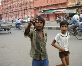 Two boys begging on the streets.