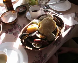 Traditional Chilean meal called “Curanto”.  It is seafood, sausage, and potato dumplings all served together