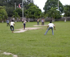 A group of men play cricket in Bangladesh.