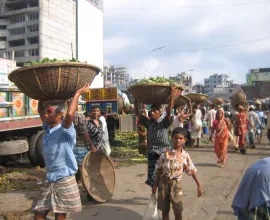 Bangladesh locals use baskets to carry goods.