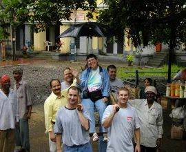 Iowa Teacher, Kay, gets carried in a village in a chair like a queen
