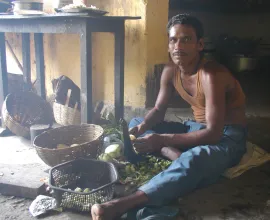 A cook prepares food in a restaurant at a rest stop.