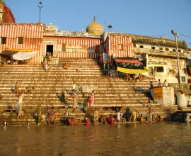 People do laundry and wash up along the shore of Varanasi.