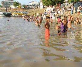 People swim at a beach in Varanasi.