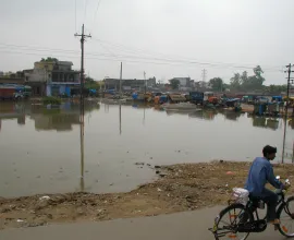 Water in the middle of Tent City, a poverty-stricken area of Agra.