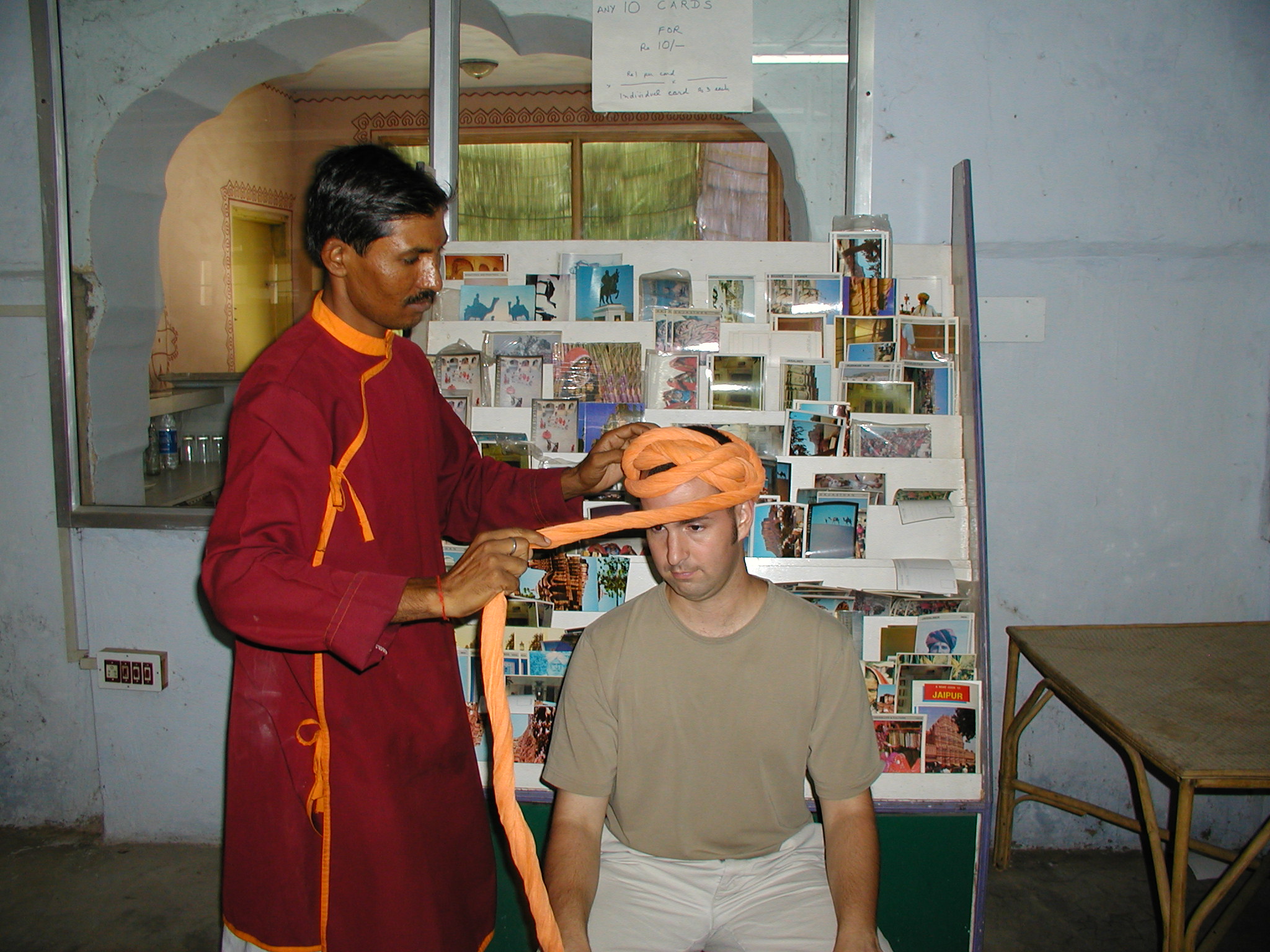 A man tying a turban 