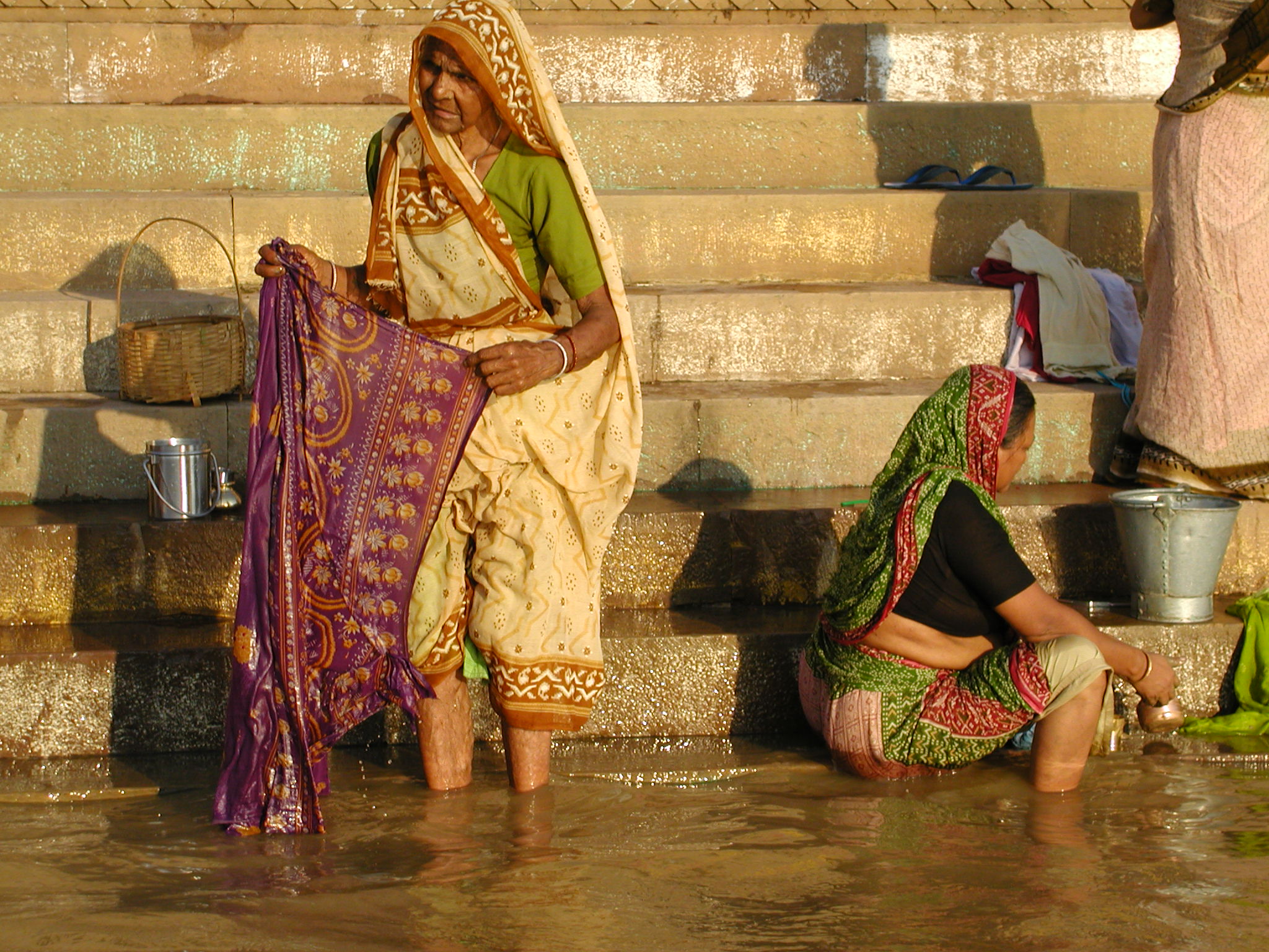 Women doing laundry on the shore in Varanasi
