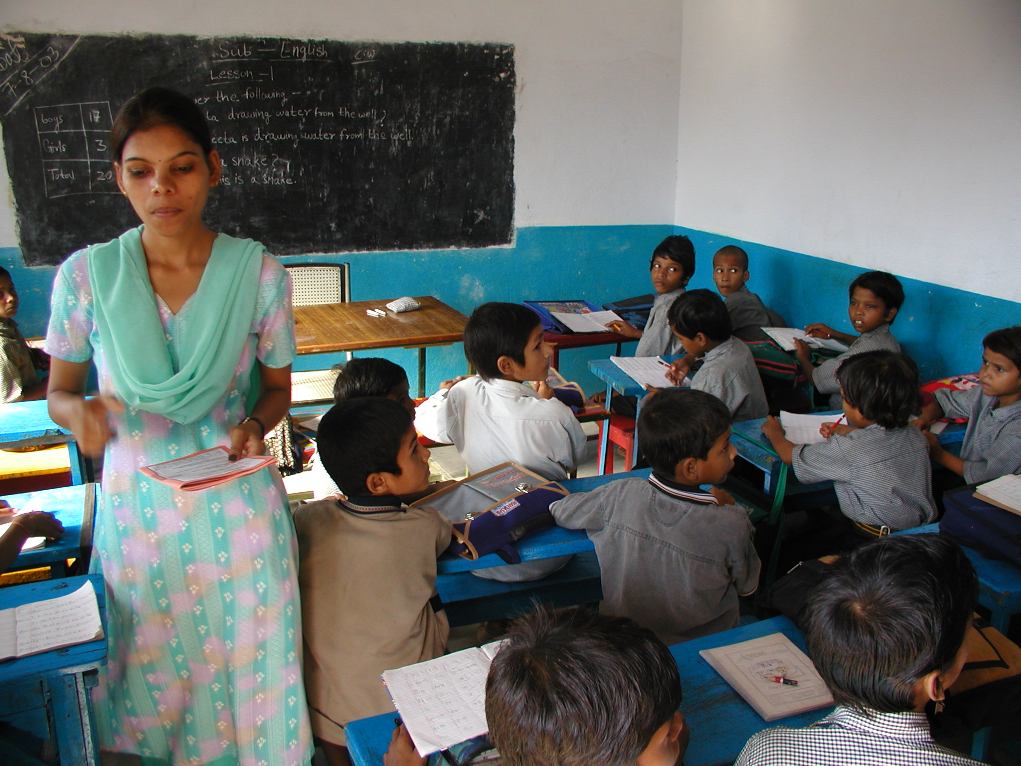 A teacher and her students in a classroom